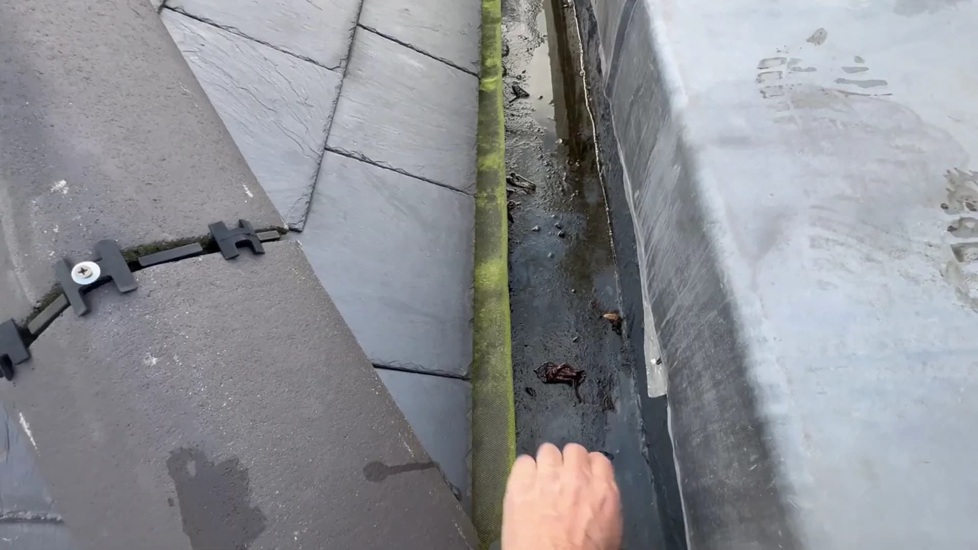 Existing fibreglass box gutter and low upstand exposed during the Chelsea roof survey