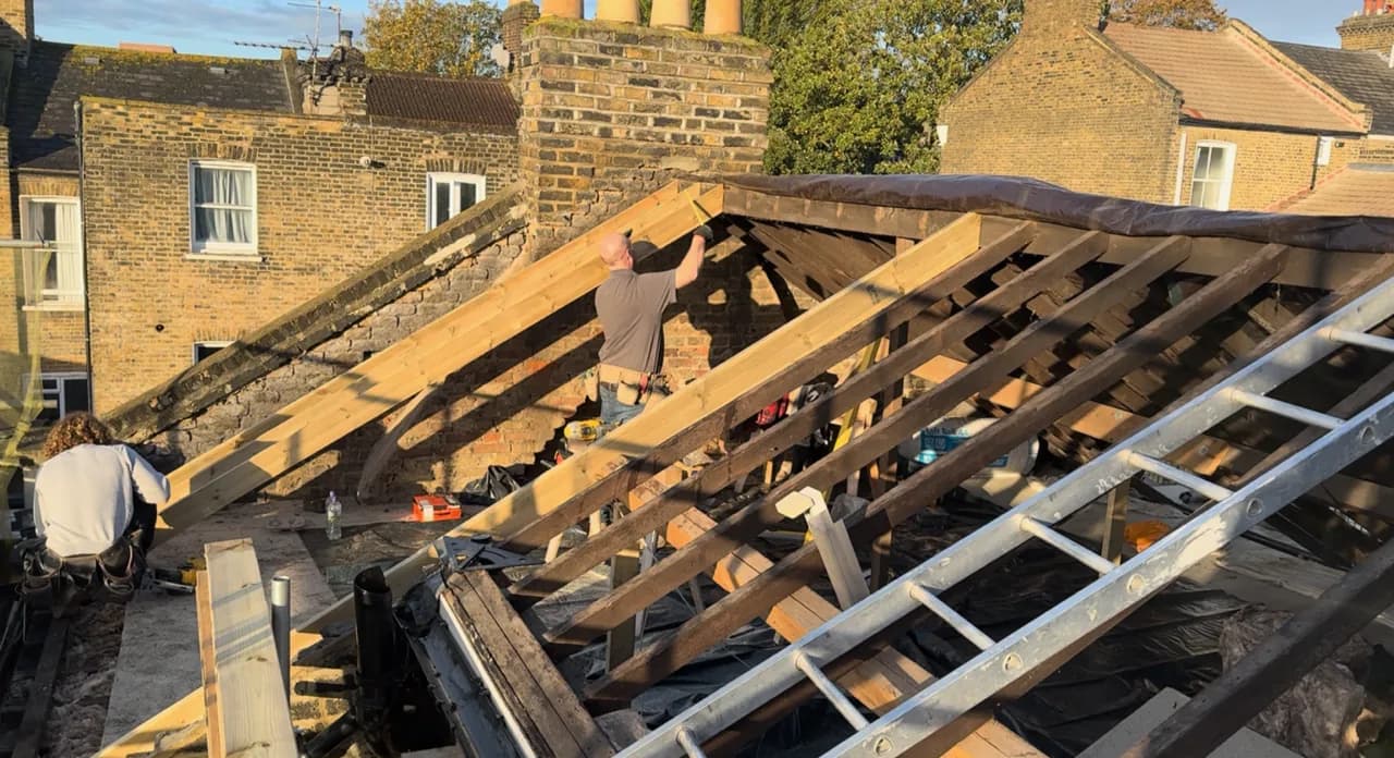 Roof covering stripped back for structural inspection and replacement work