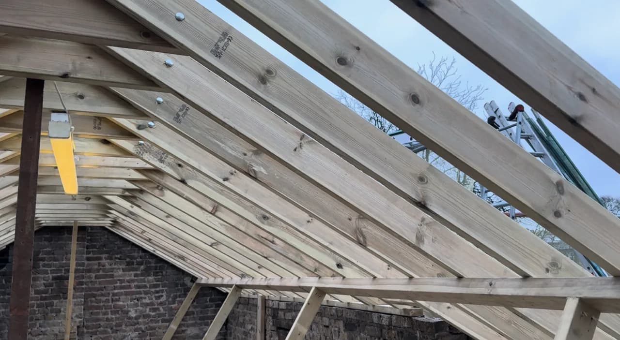 New pitched roof timbers viewed from inside the building