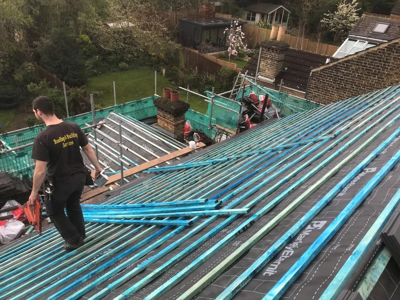 N.H.R.B.S. roofer working high on a London roof