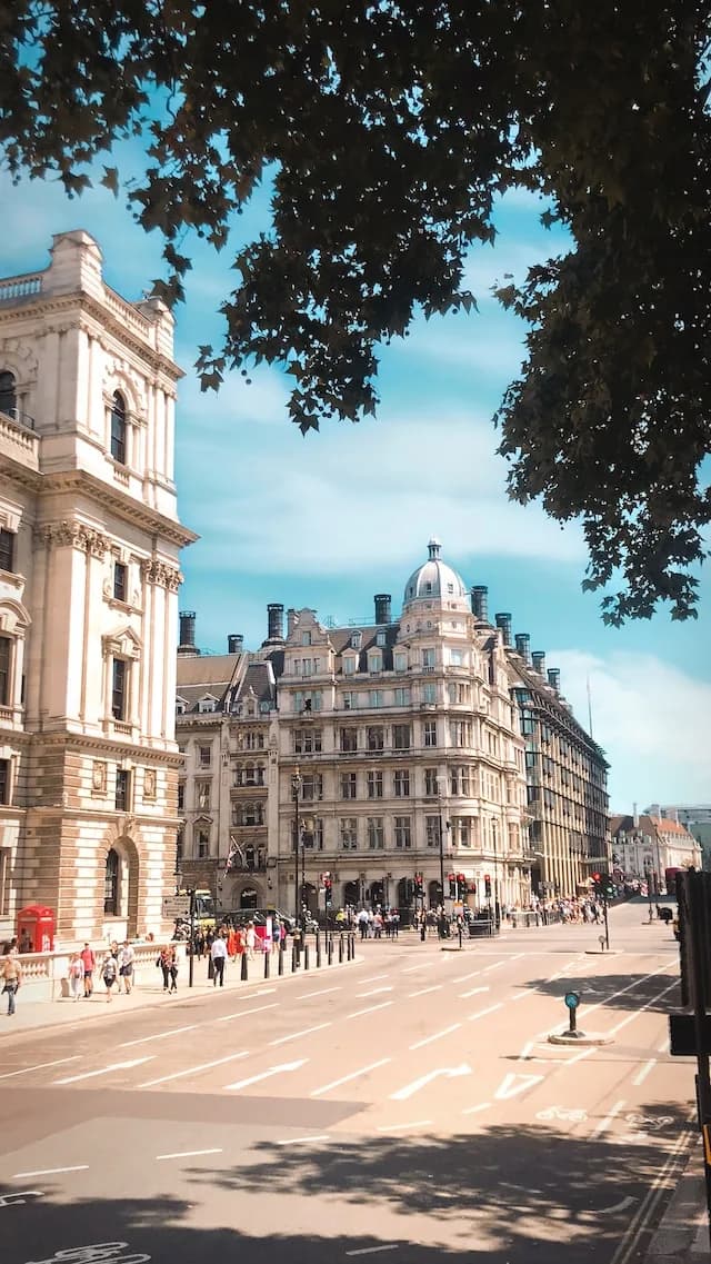 Historic Westminster architecture and London rooftops beneath a bright sky